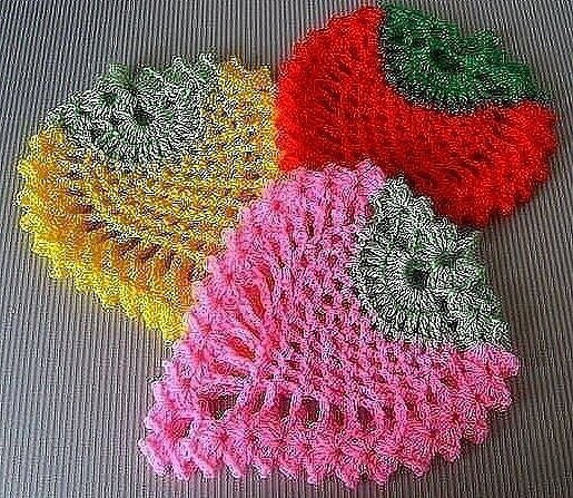 Bright crocheted potholders: yellow hexagon, floral round, and red-green diamond patterns with charts