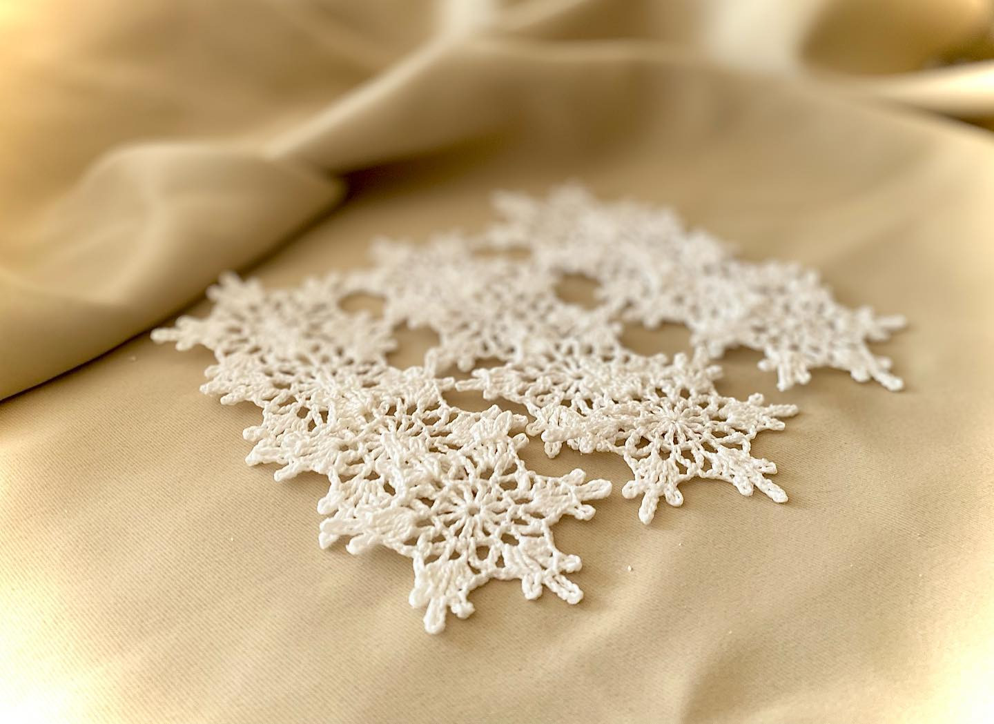 Crochet Snowflake Chart Pattern with Finished White Yarn Samples