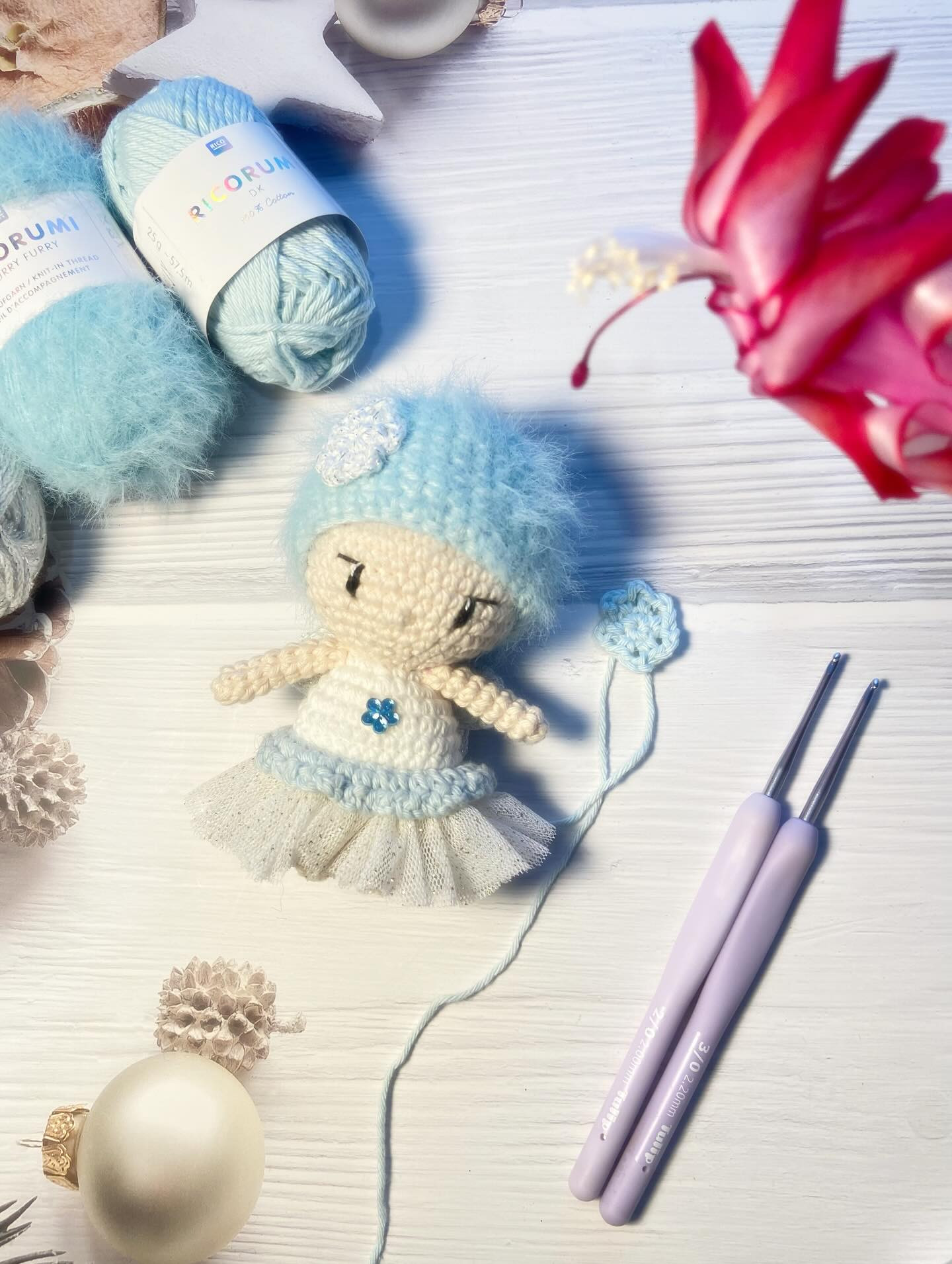 Free Crochet Pattern: Winter Fairy Amigurumi Doll with Blue Hat and Flower Bouquet