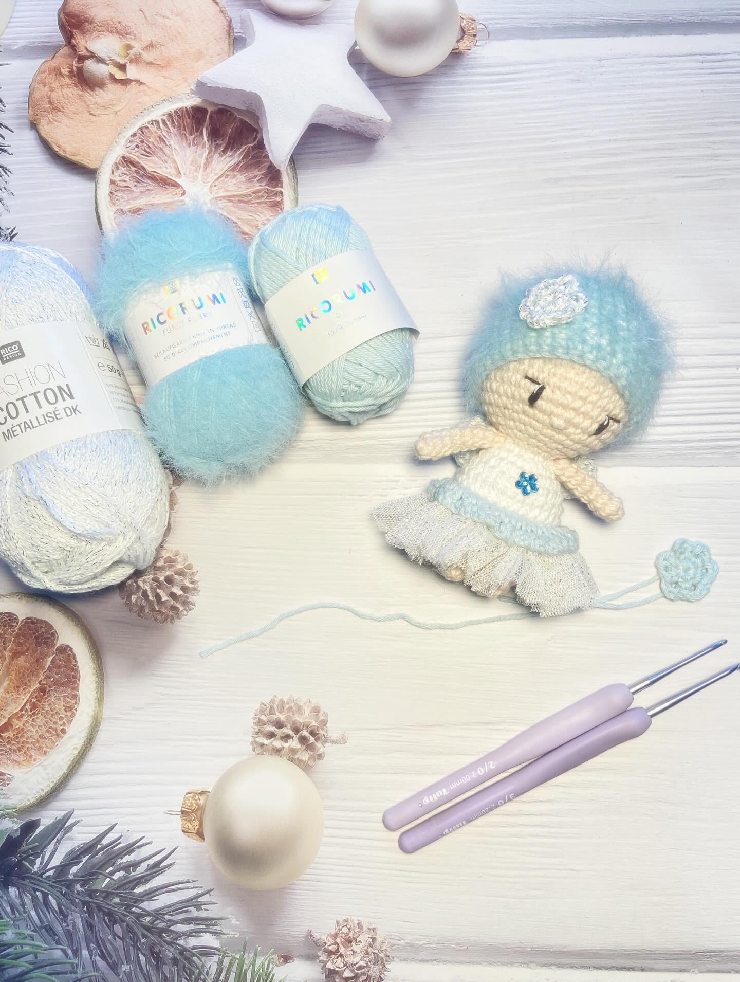 Free Crochet Pattern: Winter Fairy Amigurumi Doll with Blue Hat and Flower Bouquet