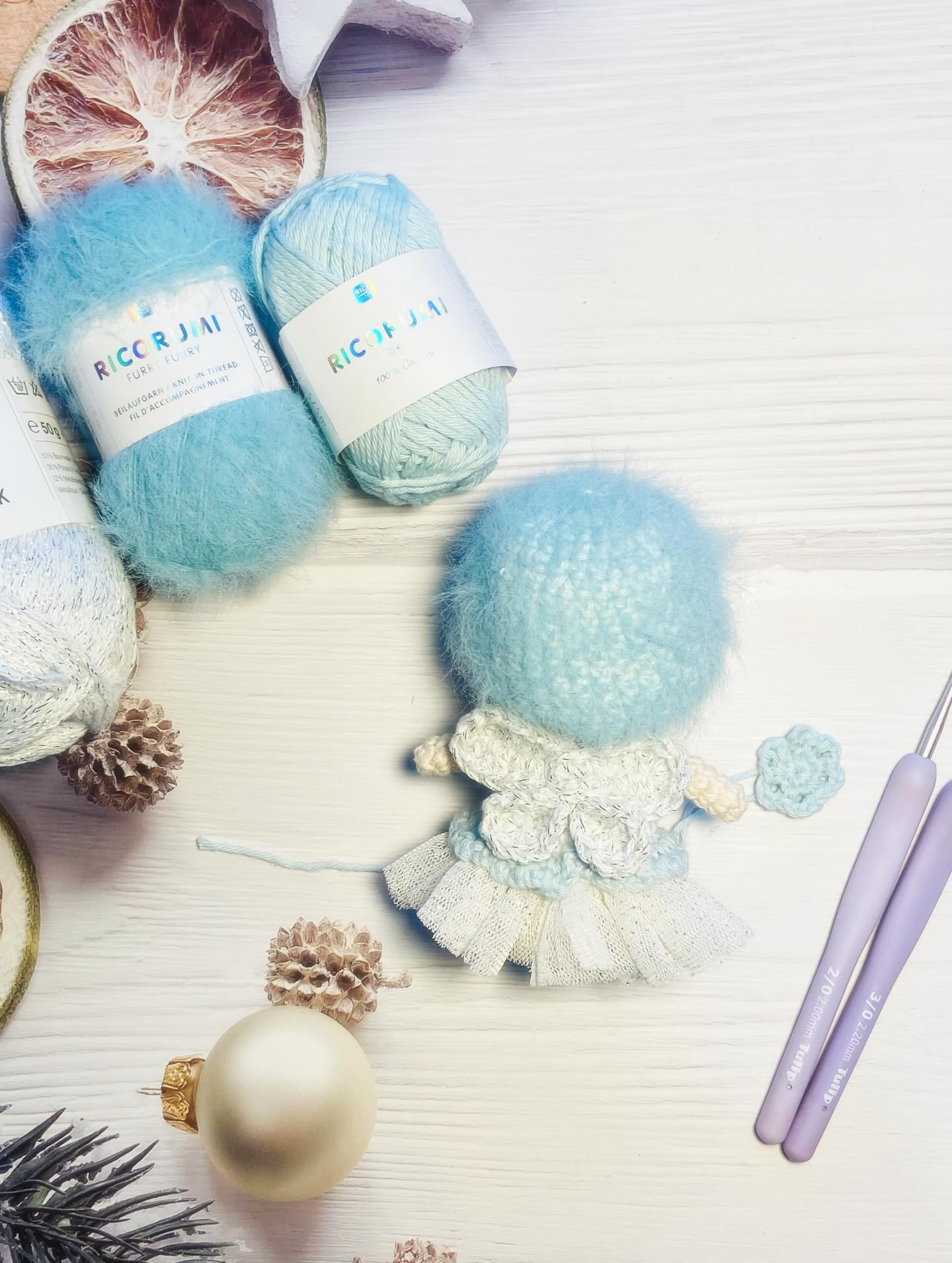 Free Crochet Pattern: Winter Fairy Amigurumi Doll with Blue Hat and Flower Bouquet