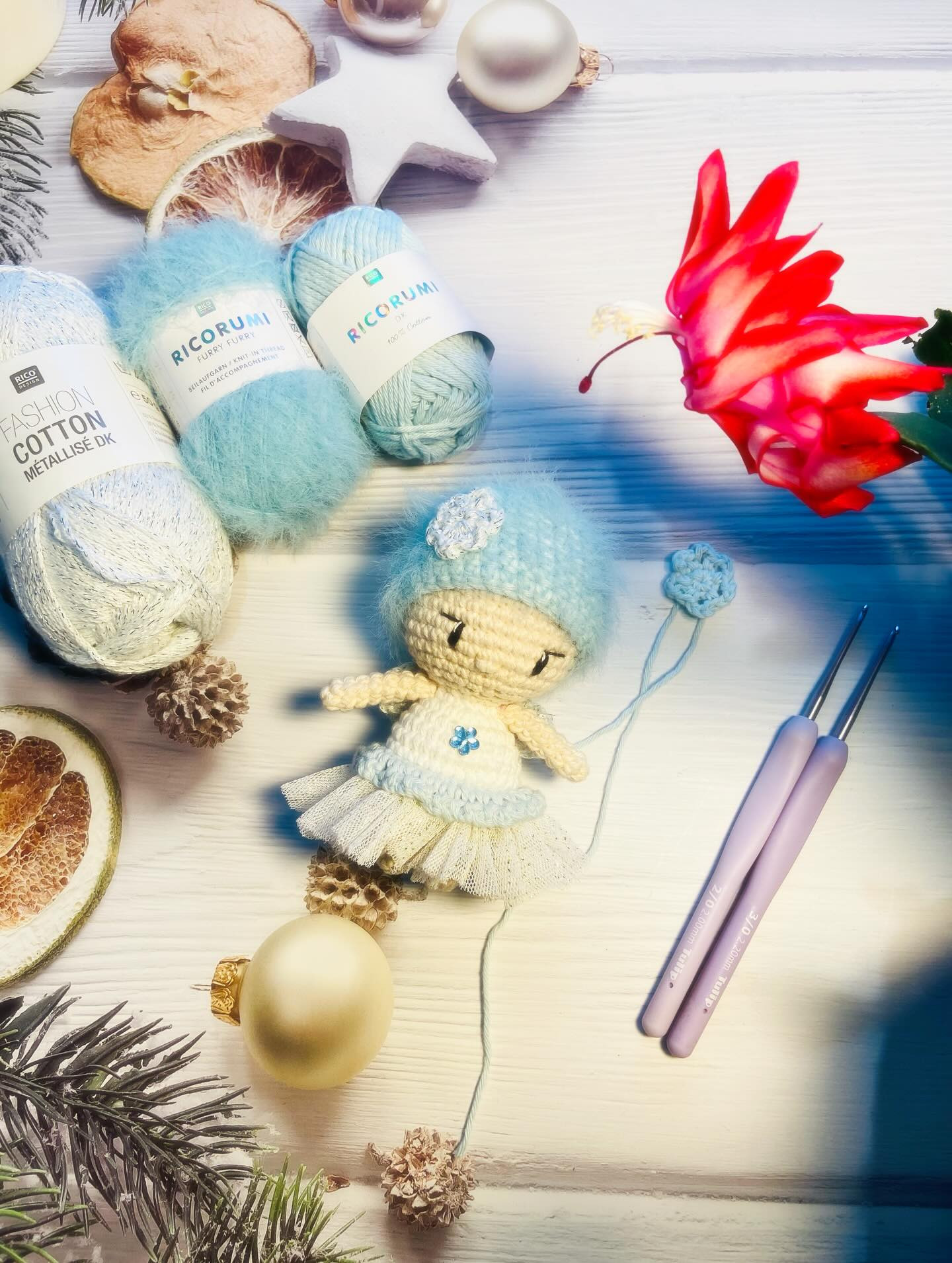Free Crochet Pattern: Winter Fairy Amigurumi Doll with Blue Hat and Flower Bouquet