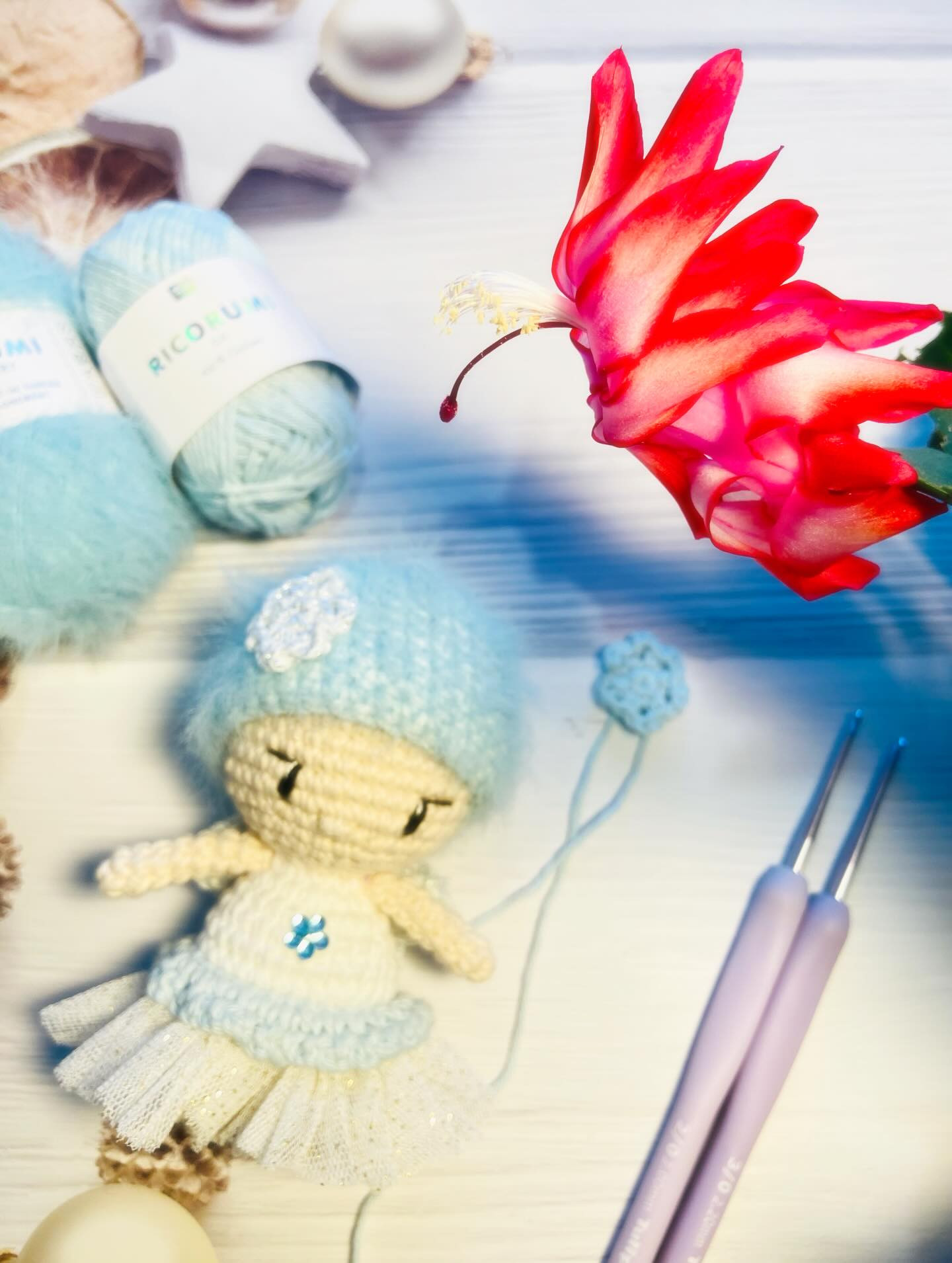Free Crochet Pattern: Winter Fairy Amigurumi Doll with Blue Hat and Flower Bouquet