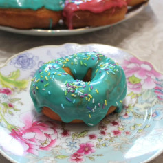 American Doughnuts with Turquoise Glaze and Colorful Sprinkles