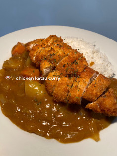Chicken Katsu Curry with rice, crispy fried chicken breast served in savory curry sauce