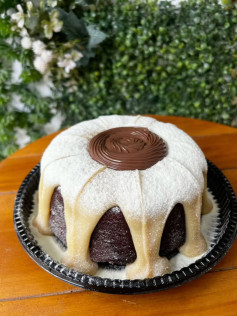 Chocolate Cake with White Cream Topping and Chocolate Center Decoration