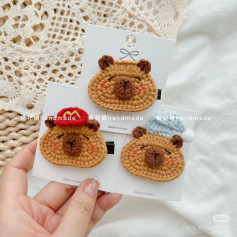 Crochet Capybara Hair Clip Pattern: Cute Brown Bear Design with Red Hat and Blue Beanie Variations