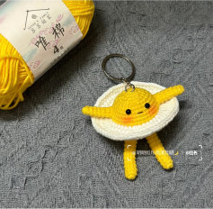 Cute Crocheted Fried Egg Character Keychain Pattern with Yellow Yolk and White Skirt