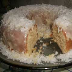 Delicious Coconut Cake with Glaze and Shredded Coconut Topping