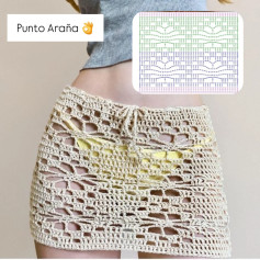 Falda playera en punto araña tejida circularmente con patrón detallado