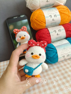 Free Crochet Pattern for Cute White Duck Doll with Red Bow and Blue Bag