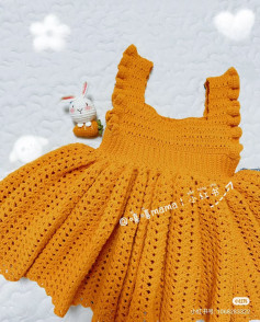 Hand-drawn crochet pattern chart for yellow ruffled dress with bow