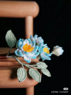 Handwritten Crochet Pattern for Blue and White Flower with Green Leaves