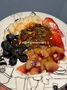 Healthy Yogurt Granola Bowl with Banana, Strawberries, Blueberries and Kiwi