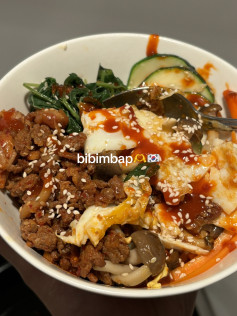 Homemade Beef Bibimbap with Gochujang Sauce, Kimchi, Spinach, Mushrooms and Fried Egg
