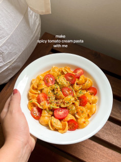 Spicy Tomato Cream Pasta Recipe: Diced onions, garlic, tomatoes
