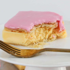 Vanilla Custard Slice: Crispy puff pastry with thick custard and pink icing