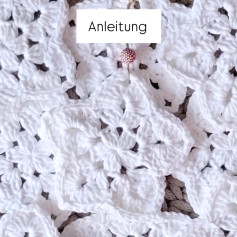 Anleitung zum Häkeln eines weißen Baumwollsterns mit Wäschestärke für Weihnachtsschmuck